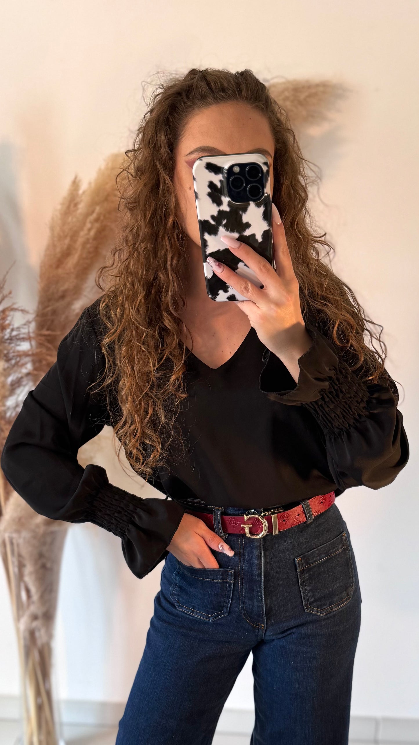 blouse noire avec manches pincées et dos nu
